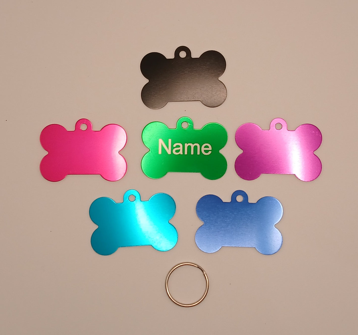 Dog ID Tags. Bone Shaped, with Steel Ring Loop. Variety of Colours. Suits Medium to Larger dogs.