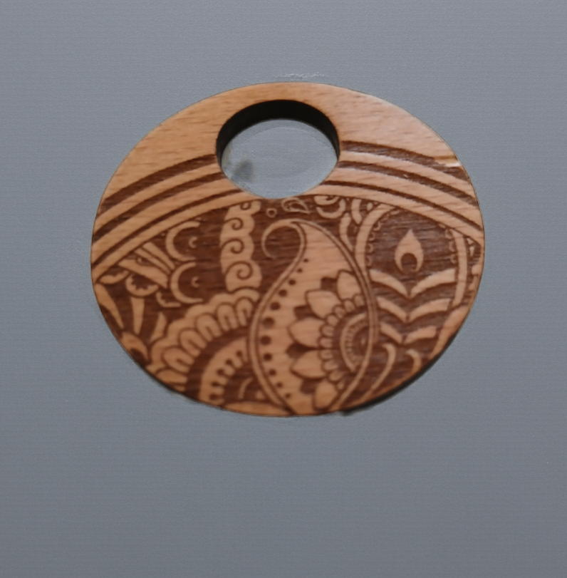 Beautiful Wood Mandala Pattern Engraved Pendant with waxed necklace. Pendant measures 50mm diameter