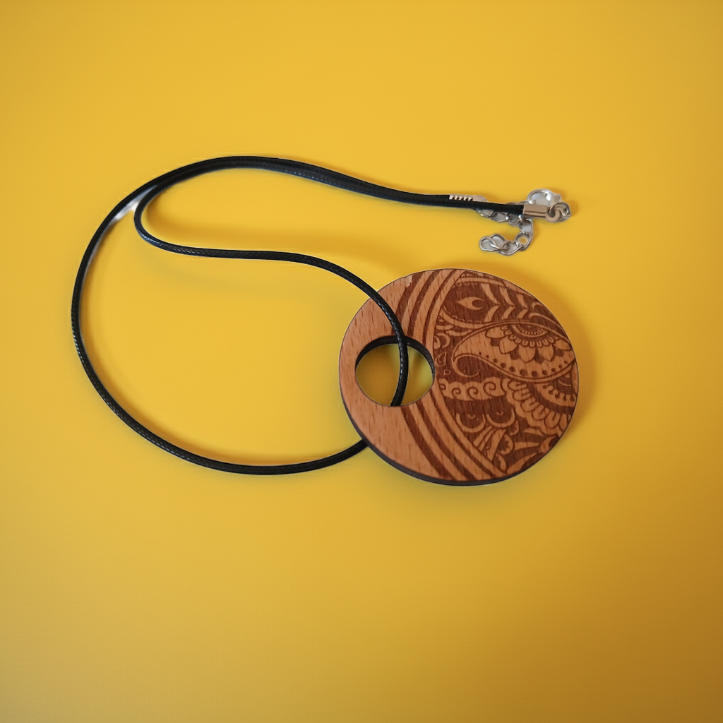 Beautiful Wood Mandala Pattern Engraved Pendant with waxed necklace. Pendant measures 50mm diameter