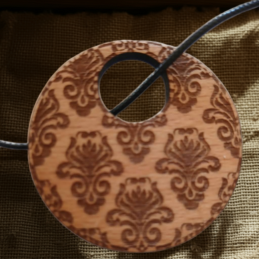 Detailed Wood Flower Pattern Engraved Pendant with waxed necklace. Pendant measures 50mm diameter