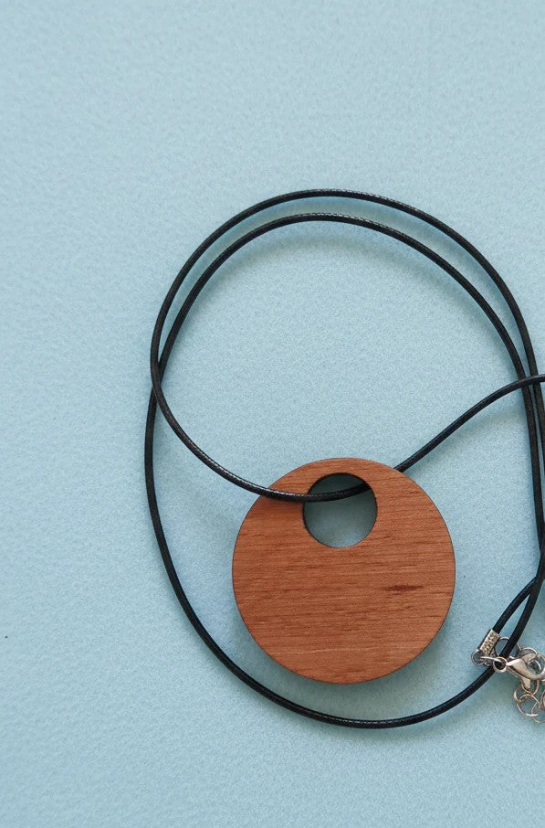 Personalised Wood Pendant with a Bee and Floral engraving, with waxed necklace. Pendant measures 50mm diameter.