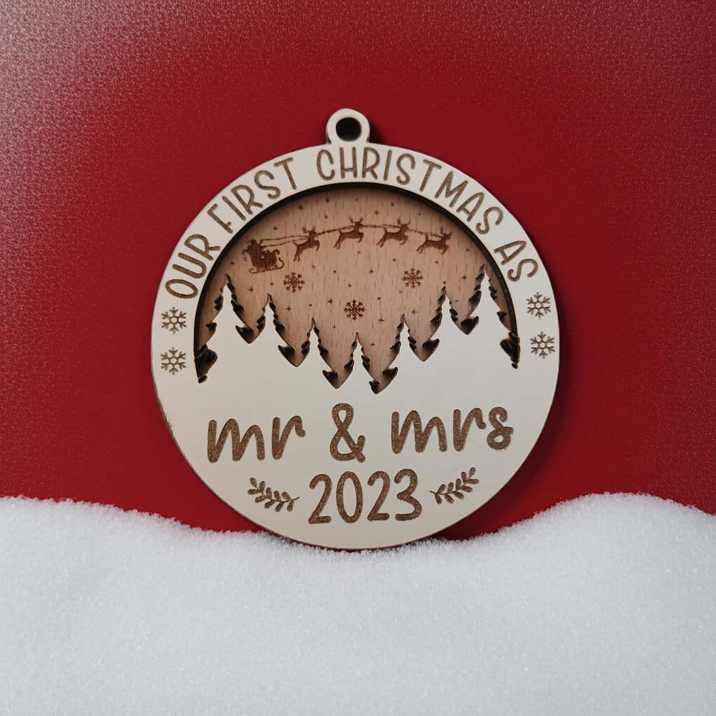 x2 Our First Christmas, Wood Christmas Tree Bauble. 70mm diameter, 6mm thick. Personalise with year and title of choice e.g. Mr & Mrs