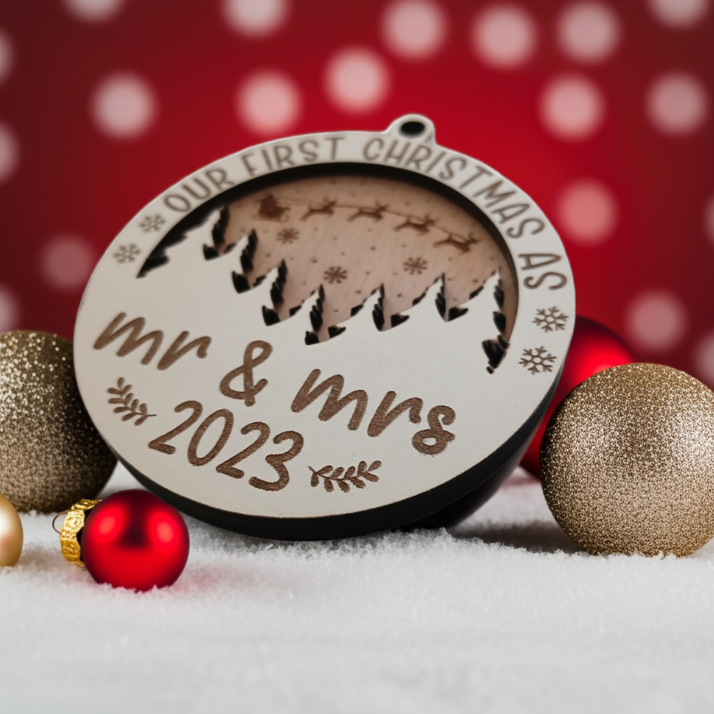 x2 Our First Christmas, Wood Christmas Tree Bauble. 70mm diameter, 6mm thick. Personalise with year and title of choice e.g. Mr & Mrs