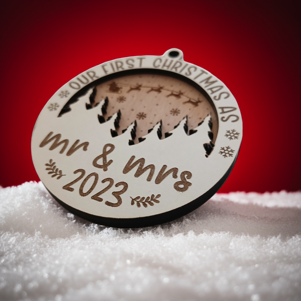 x2 Our First Christmas, Wood Christmas Tree Bauble. 70mm diameter, 6mm thick. Personalise with year and title of choice e.g. Mr & Mrs