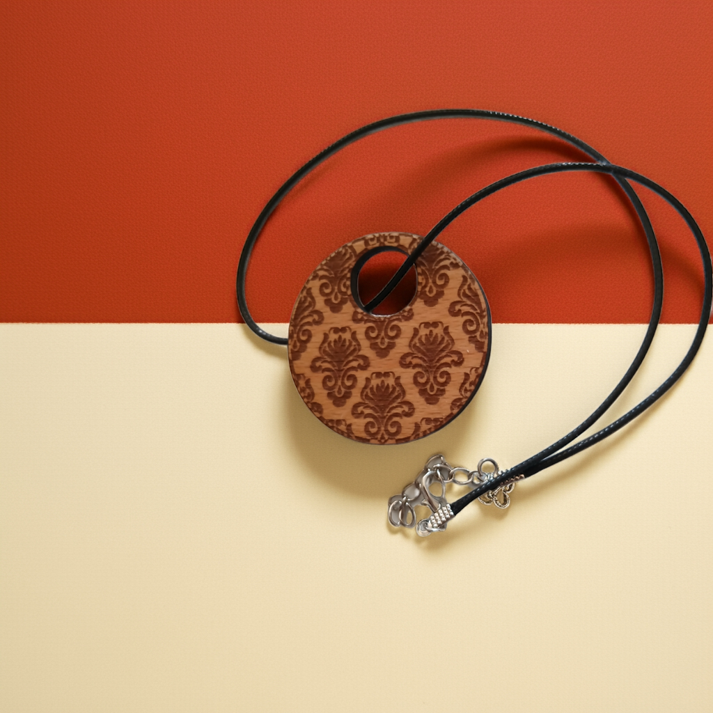 Detailed Wood Flower Pattern Engraved Pendant with waxed necklace. Pendant measures 50mm diameter