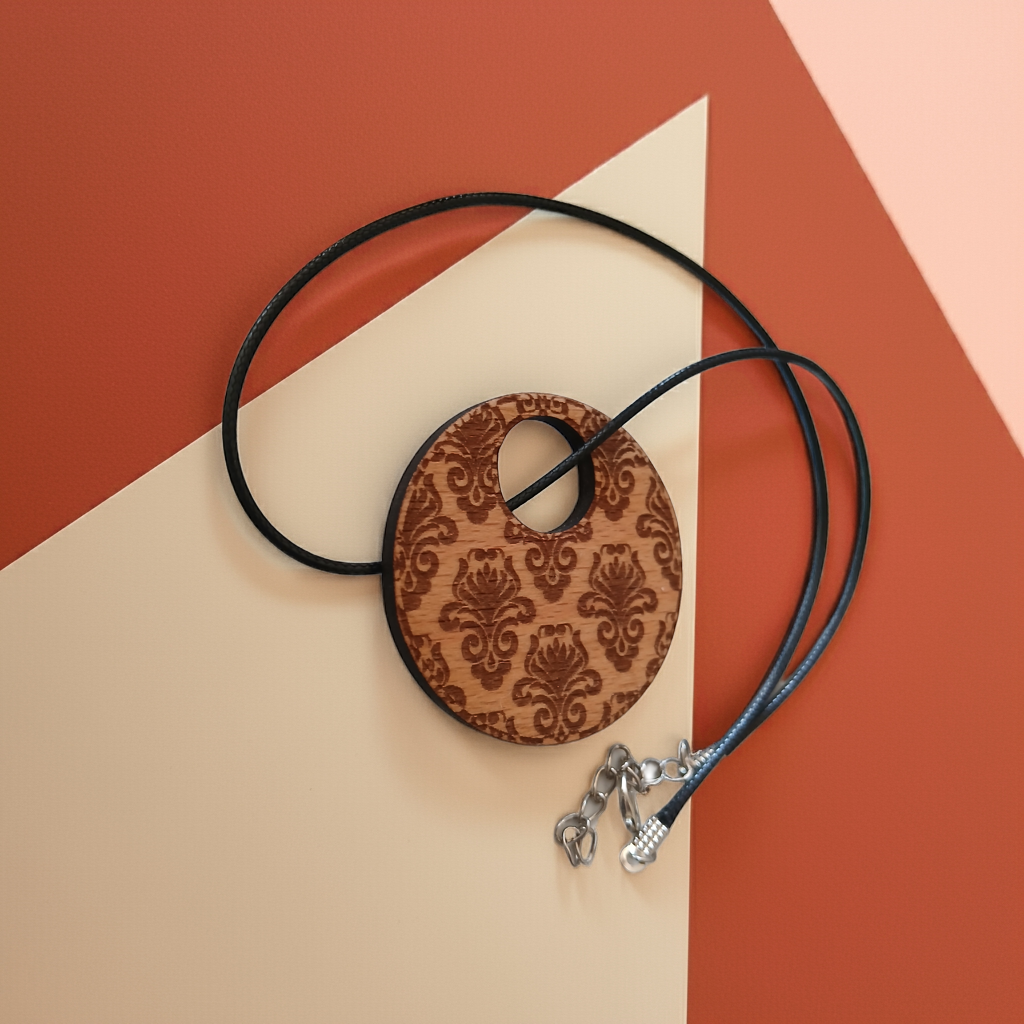 Detailed Wood Flower Pattern Engraved Pendant with waxed necklace. Pendant measures 50mm diameter