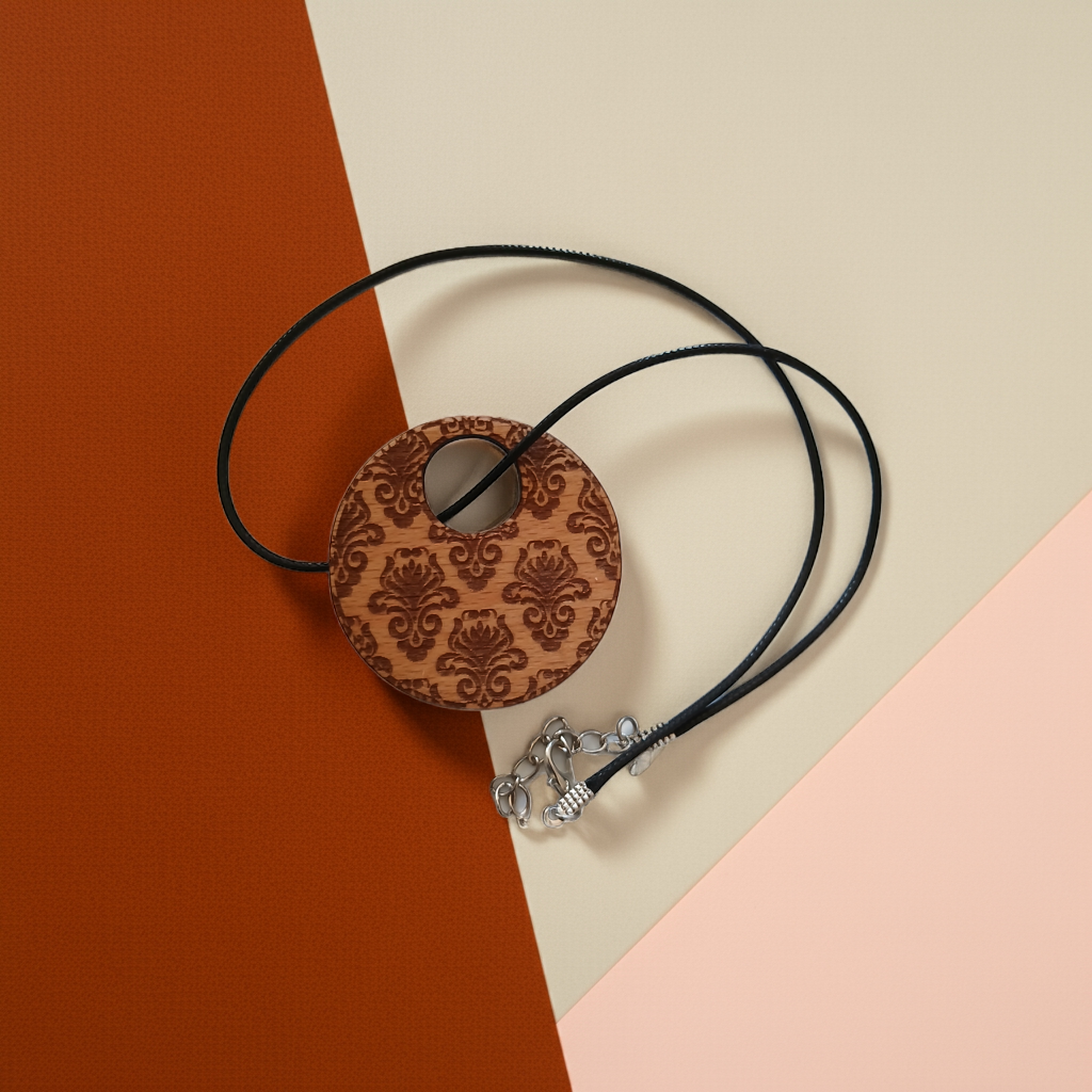 Detailed Wood Flower Pattern Engraved Pendant with waxed necklace. Pendant measures 50mm diameter