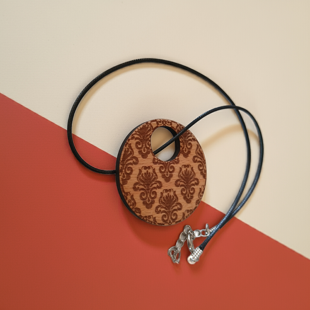 Detailed Wood Flower Pattern Engraved Pendant with waxed necklace. Pendant measures 50mm diameter