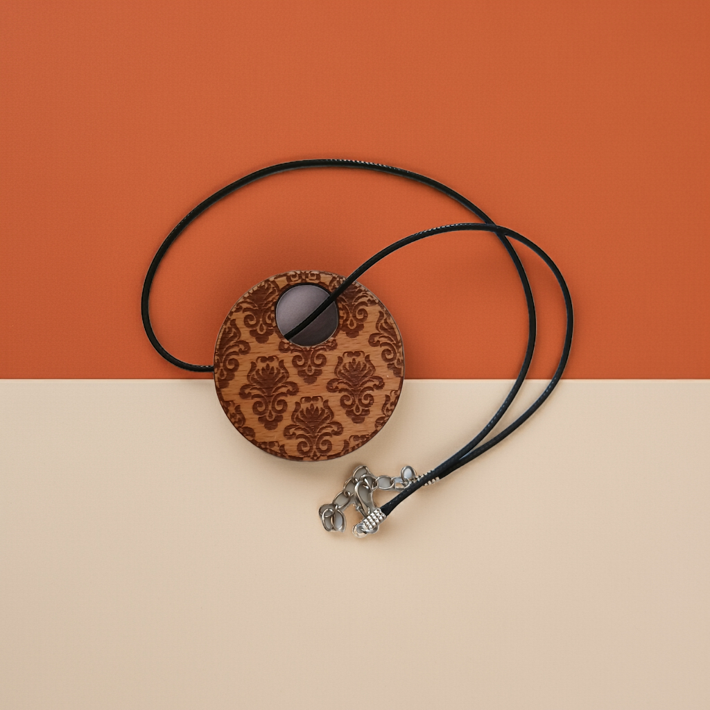Detailed Wood Flower Pattern Engraved Pendant with waxed necklace. Pendant measures 50mm diameter