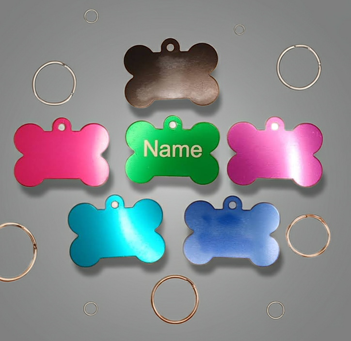 Dog ID Tags. Bone Shaped, with Steel Ring Loop. Variety of Colours. Suits Medium to Larger dogs.