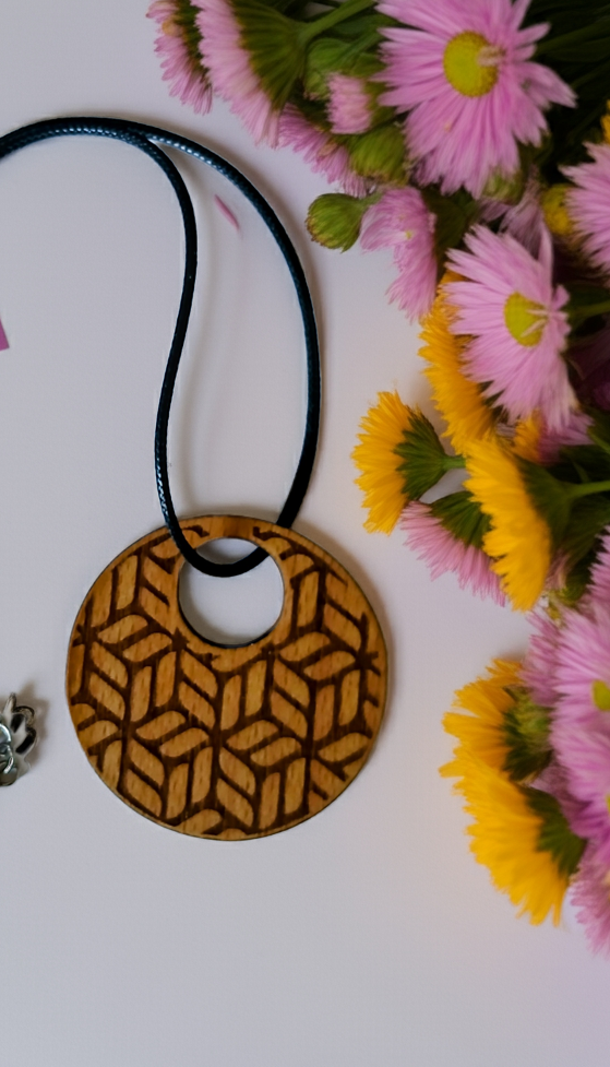 Exquisite Beech Wood Engraved Pendant with waxed necklace. Size 50 mm.