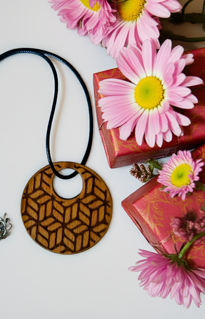Exquisite Beech Wood Engraved Pendant with waxed necklace. Size 50 mm.