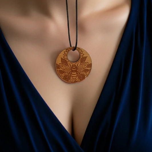 Personalised Wood Pendant with a Bee and Floral engraving, with waxed necklace. Pendant measures 50mm diameter.