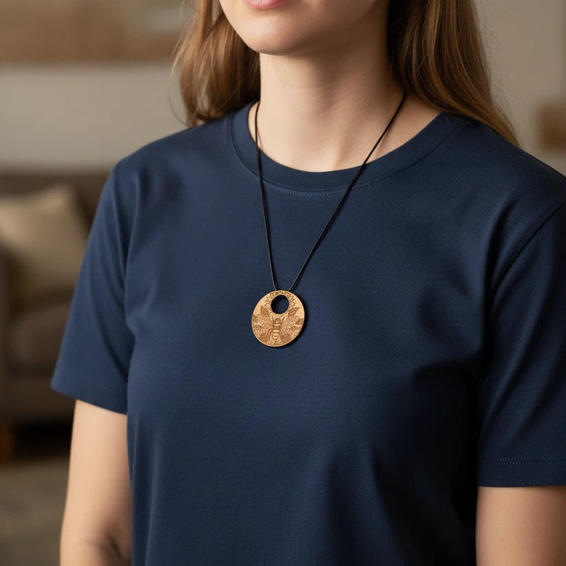 Personalised Wood Pendant with a Bee and Floral engraving, with waxed necklace. Pendant measures 50mm diameter.