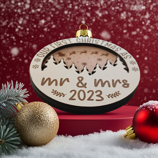 x2 Our First Christmas, Wood Christmas Tree Bauble. 70mm diameter, 6mm thick. Personalise with year and title of choice e.g. Mr & Mrs